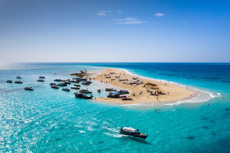Nakupenda sandbank boats on turquoise water off Zanzibar